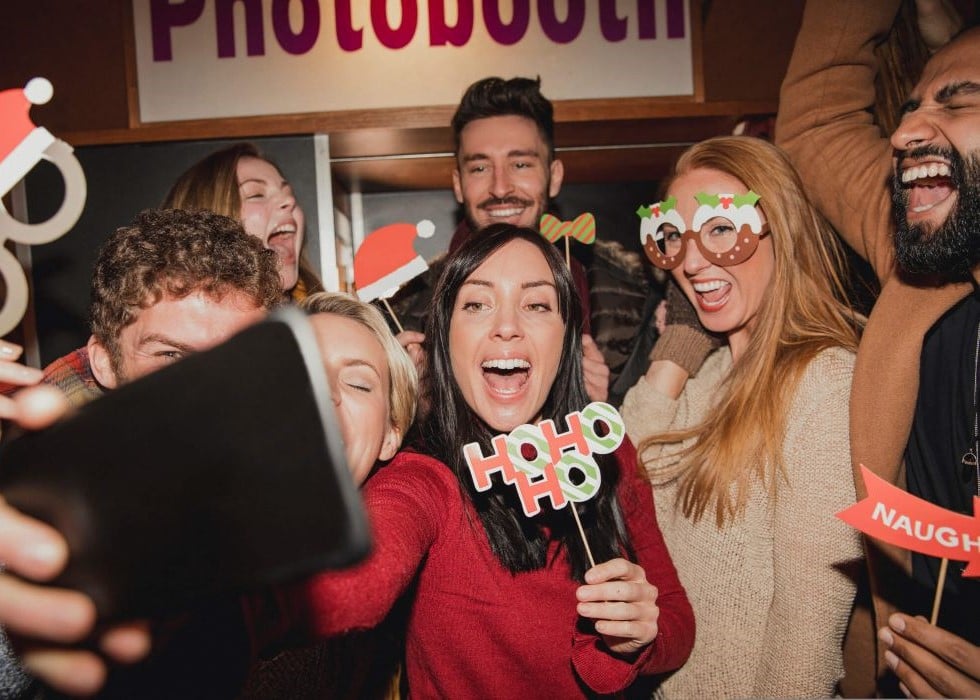 holiday-event-elevate-av People celebrating holiday party with selfie